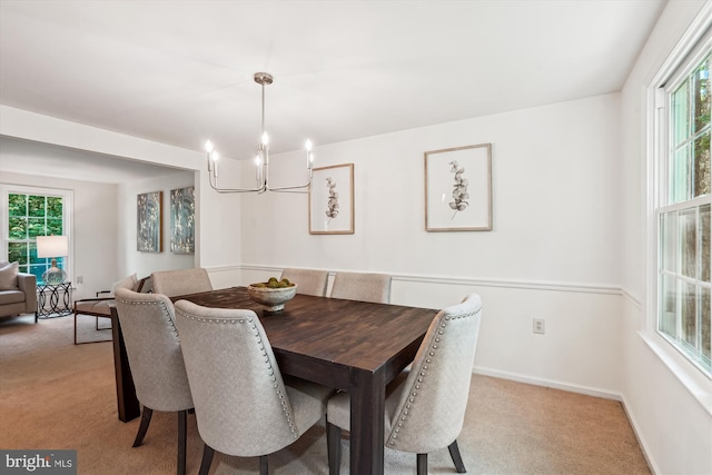 5938 New England Woods Dr, Burke, VA 22015 - dining room featuring light carpet, a chandelier, and plenty of natural light