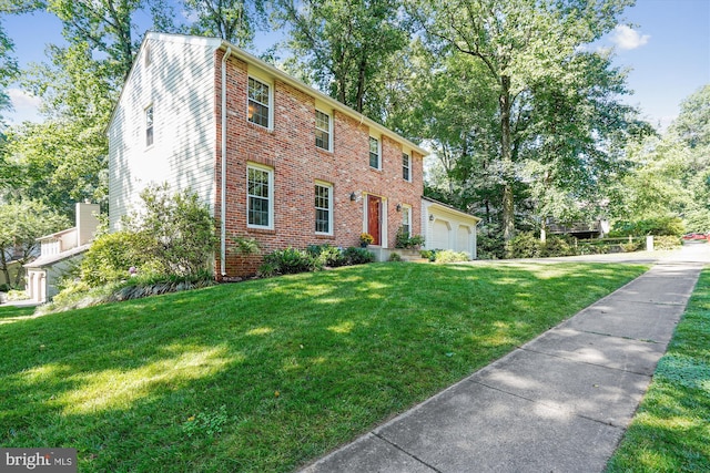 5938 New England Woods Dr, Burke, VA 22015 - colonial house featuring a front yard and brick siding