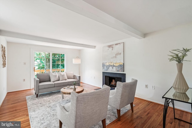 5938 New England Woods Dr, Burke, VA 22015 - living area with a fireplace, wood finished floors, and beam ceiling