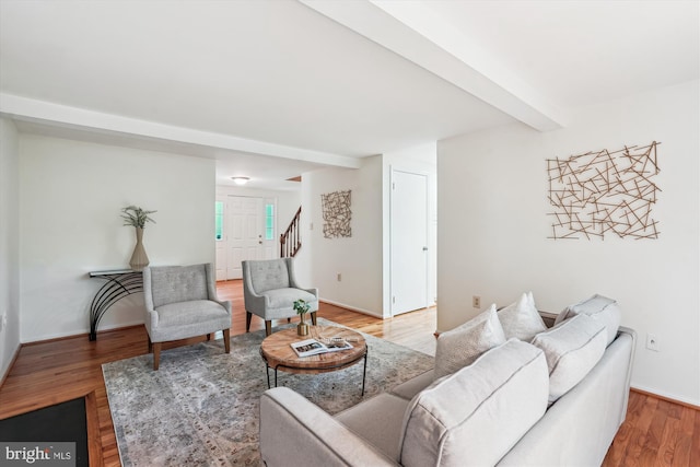 5938 New England Woods Dr, Burke, VA 22015 - living room featuring beamed ceiling, wood finished floors, and stairway