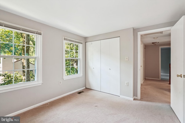 5938 New England Woods Dr, Burke, VA 22015 - unfurnished bedroom featuring carpet and a closet