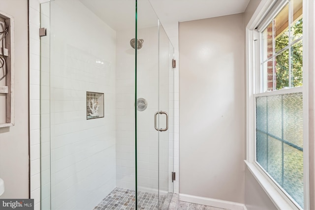 5938 New England Woods Dr, Burke, VA 22015 - bathroom featuring a shower stall and baseboards