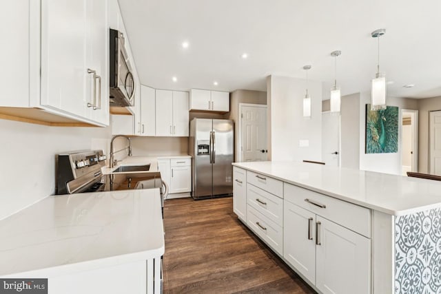 12001 Old Columbia Pike Unit 407, Silver Spring, MD 20904 - kitchen with appliances with stainless steel finishes, a sink, white cabinetry, dark wood finished floors, and light countertops