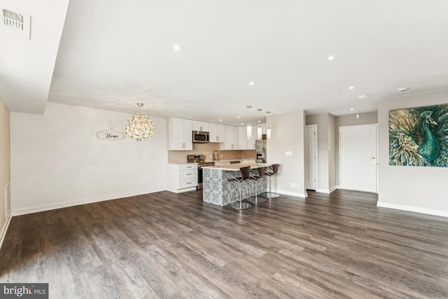 12001 Old Columbia Pike Unit 407, Silver Spring, MD 20904 - living room with baseboards, dark wood-style flooring, recessed lighting, and a chandelier