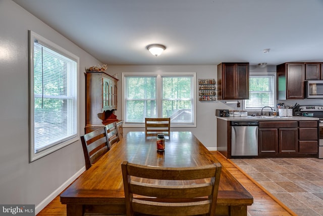 436 Strobridge Rd, Inwood, WV 25428 - kitchen featuring appliances with stainless steel finishes, a sink, dark brown cabinets, light countertops, and baseboards