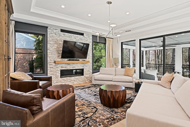 1564 Forest Villa Ln, Mclean, VA 22101 - living room featuring wood finished floors, healthy amount of natural light, a tray ceiling, a fireplace, and recessed lighting