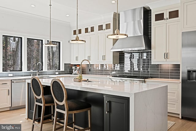 1564 Forest Villa Ln, Mclean, VA 22101 - kitchen with wall chimney range hood, a sink, stainless steel appliances, a kitchen island with sink, and tasteful backsplash