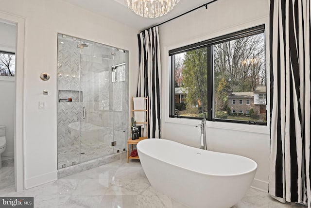 1564 Forest Villa Ln, Mclean, VA 22101 - full bathroom with marble tiled floors, a shower stall, a soaking tub, toilet, and a chandelier