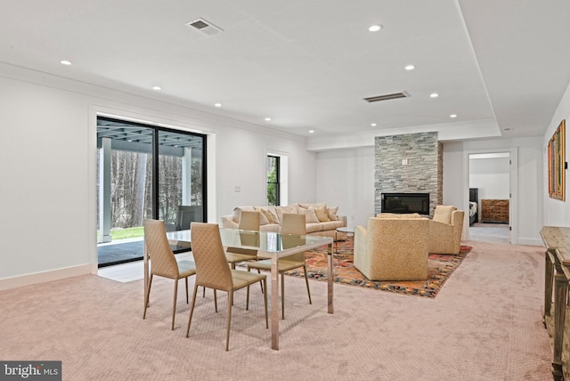 1564 Forest Villa Ln, Mclean, VA 22101 - dining space with light carpet, recessed lighting, crown molding, a stone fireplace, and baseboards