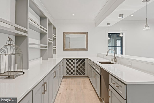 1564 Forest Villa Ln, Mclean, VA 22101 - kitchen featuring a sink, a peninsula, gray cabinets, light wood finished floors, and recessed lighting