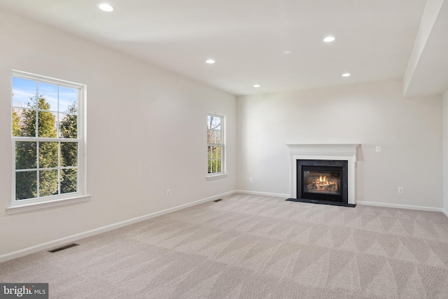 100 Fiesta Dr, Stephenson, VA 22656 - unfurnished living room with light carpet, recessed lighting, baseboards, and a fireplace with flush hearth