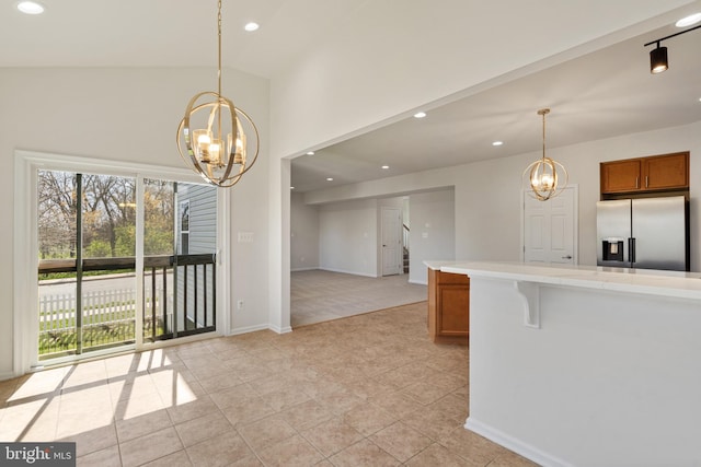 100 Fiesta Dr, Stephenson, VA 22656 - kitchen featuring stainless steel refrigerator with ice dispenser, a chandelier, brown cabinetry, light countertops, and recessed lighting