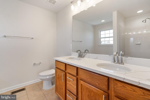100 Fiesta Dr, Stephenson, VA 22656 - full bath with tile patterned flooring, toilet, double vanity, a tile shower, and baseboards