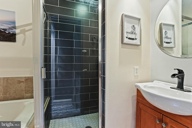 220 S E Ave, Baltimore, MD 21224 - bathroom with a tile shower, vanity, and a tub to relax in