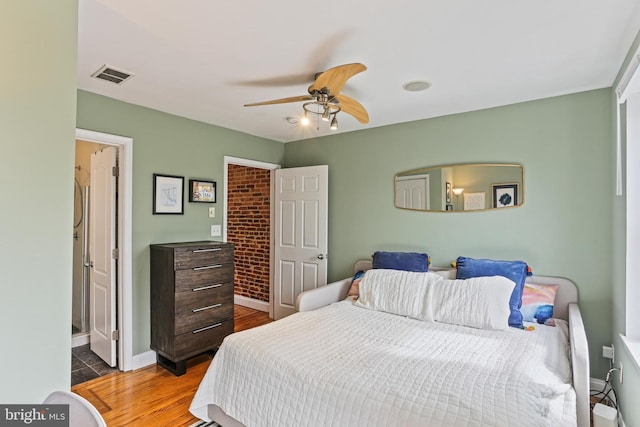 220 S E Ave, Baltimore, MD 21224 - bedroom featuring wood finished floors, a ceiling fan, and baseboards