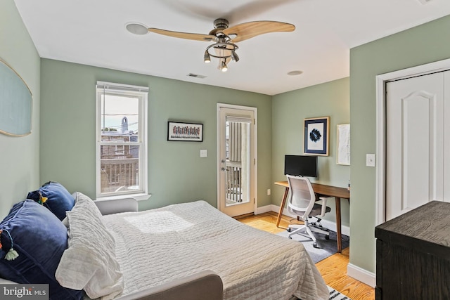 220 S E Ave, Baltimore, MD 21224 - bedroom featuring light wood-style flooring, baseboards, and an office area