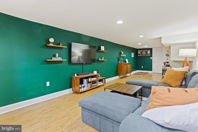 220 S E Ave, Baltimore, MD 21224 - living area with baseboards, wood finished floors, an accent wall, and recessed lighting