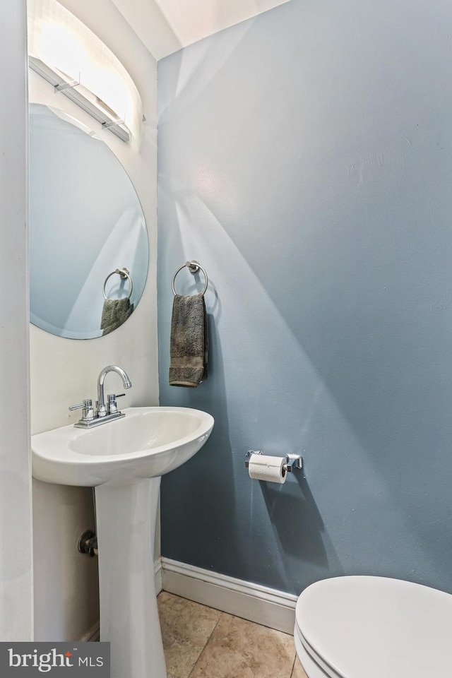 220 S E Ave, Baltimore, MD 21224 - bathroom featuring baseboards and toilet