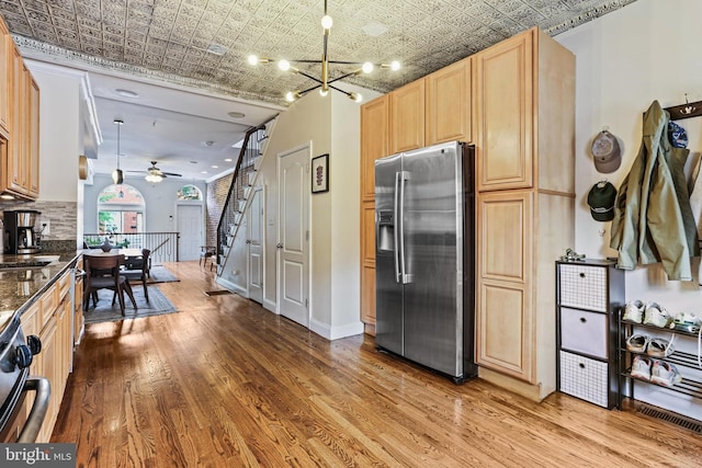 220 S E Ave, Baltimore, MD 21224 - kitchen featuring stainless steel fridge with ice dispenser, an ornate ceiling, wood finished floors, light brown cabinets, and a ceiling fan