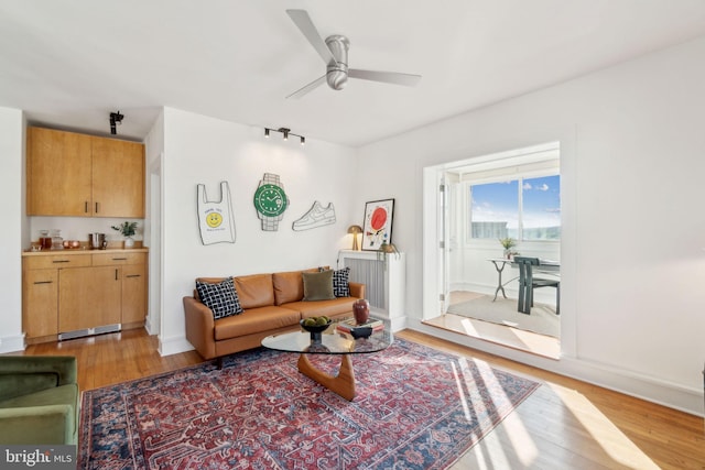 1901 Columbia Rd NW Unit 805, Washington, DC 20009 - living area with light wood-style flooring, ceiling fan, and baseboards