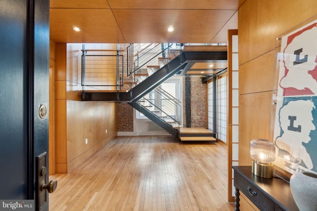 1901 Columbia Rd NW Unit 805, Washington, DC 20009 - foyer entrance with stairway, hardwood / wood-style flooring, baseboards, and brick wall