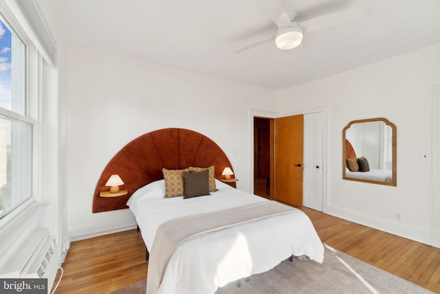 1901 Columbia Rd NW Unit 805, Washington, DC 20009 - bedroom featuring light wood-style floors, multiple windows, and baseboards