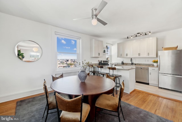 1901 Columbia Rd NW Unit 805, Washington, DC 20009 - dining space with light wood-style flooring, ceiling fan, and track lighting