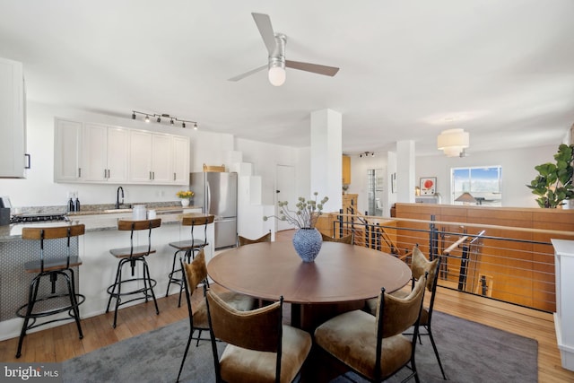1901 Columbia Rd NW Unit 805, Washington, DC 20009 - dining space with light wood-style floors, a ceiling fan, and rail lighting