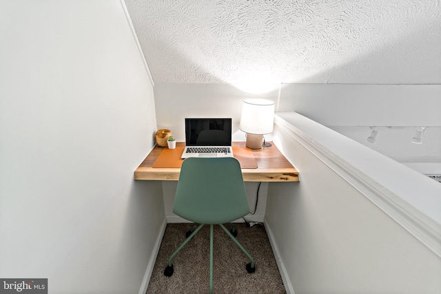 114 Limestone Ln, Berkeley Springs, WV 25411 - carpeted office featuring built in desk, baseboards, and a textured ceiling