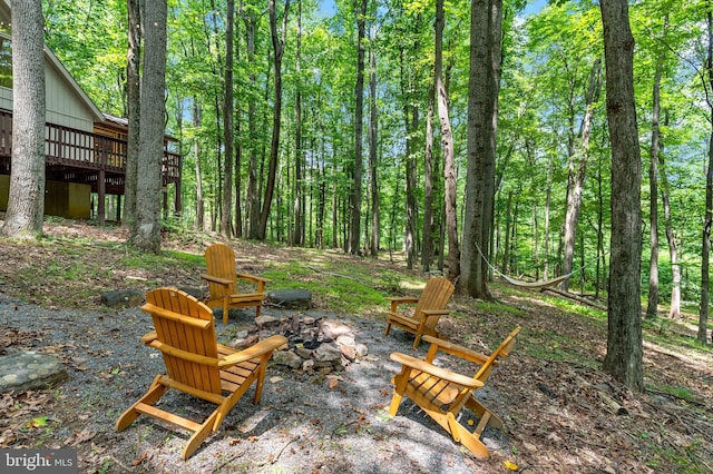 114 Limestone Ln, Berkeley Springs, WV 25411 - view of patio featuring a fire pit, a deck, and a forest view