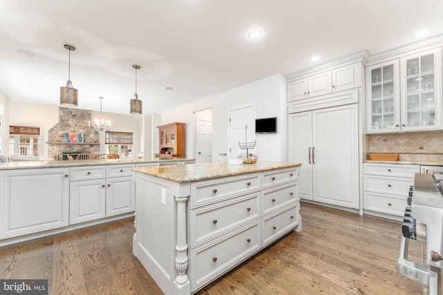 201 Dogwood Slope Rd, Wilmington, DE 19807 - kitchen with wood finished floors, range, backsplash, white cabinets, and recessed lighting