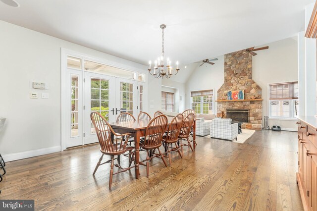 201 Dogwood Slope Rd, Wilmington, DE 19807 - dining area with wood finished floors, french doors, a ceiling fan, a fireplace, and plenty of natural light