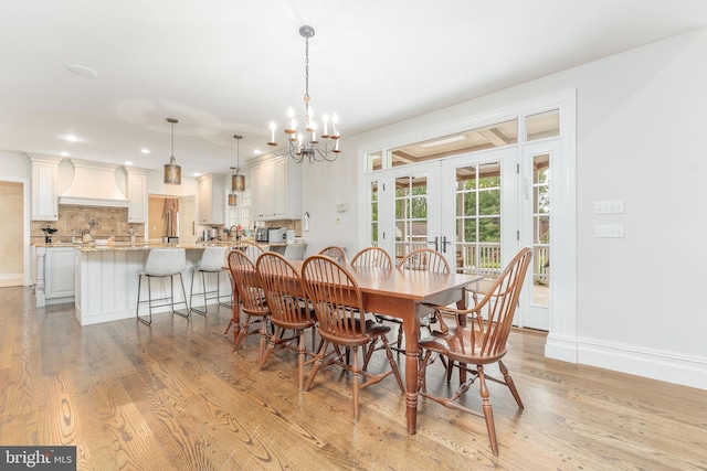 201 Dogwood Slope Rd, Wilmington, DE 19807 - dining space with french doors, light wood finished floors, a chandelier, and recessed lighting