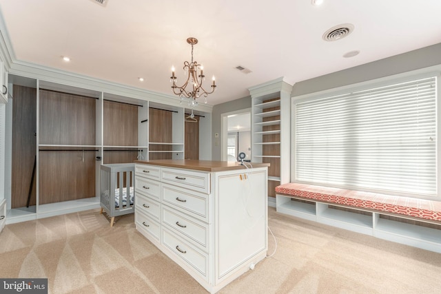 201 Dogwood Slope Rd, Wilmington, DE 19807 - walk in closet featuring light carpet and a chandelier