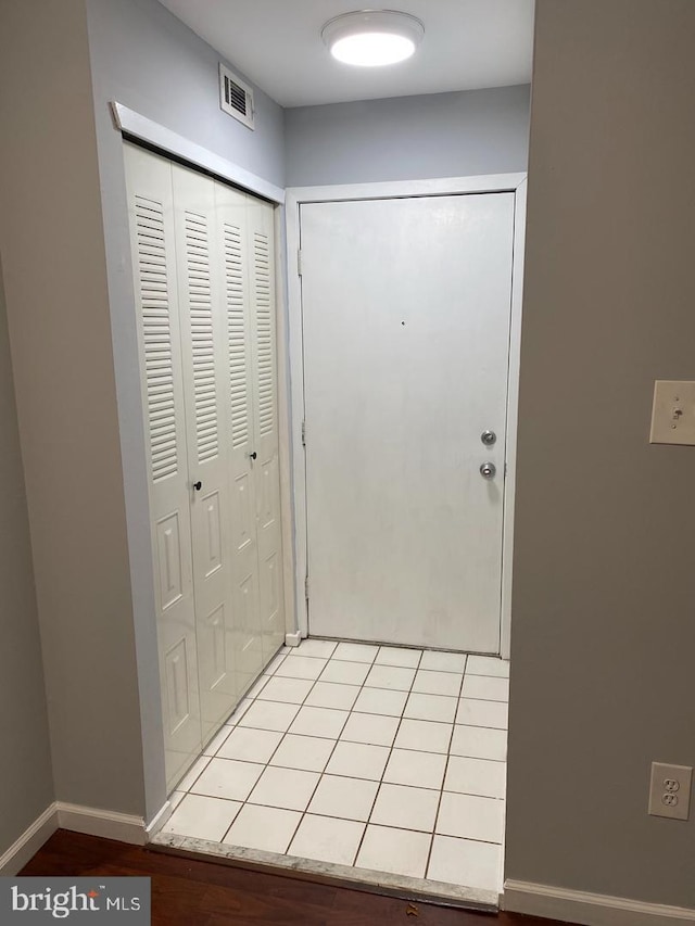 hallway featuring baseboards