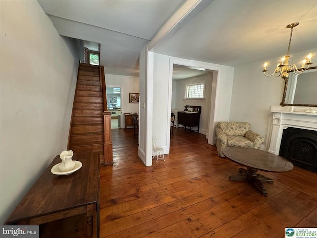 35 W Broadway, Jim Thorpe, PA 18229 - living area with hardwood / wood-style floors, a chandelier, a fireplace, stairs, and baseboards