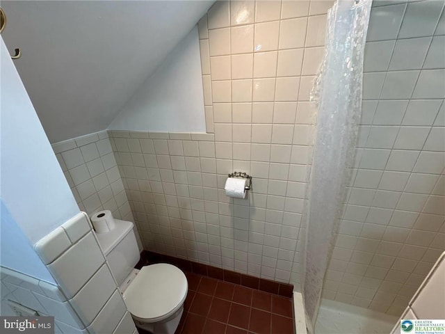 35 W Broadway, Jim Thorpe, PA 18229 - full bathroom with vaulted ceiling, toilet, tile walls, a shower stall, and tile patterned floors