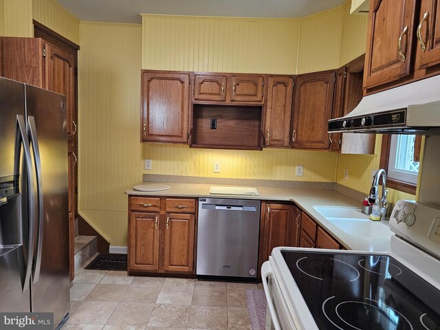 304 Pulaski St, Cumberland, MD 21502 - kitchen with appliances with stainless steel finishes, under cabinet range hood, a sink, and light countertops