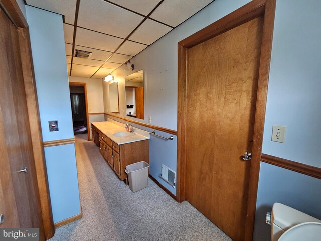 304 Pulaski St, Cumberland, MD 21502 - bathroom with a paneled ceiling, vanity, toilet, and baseboards