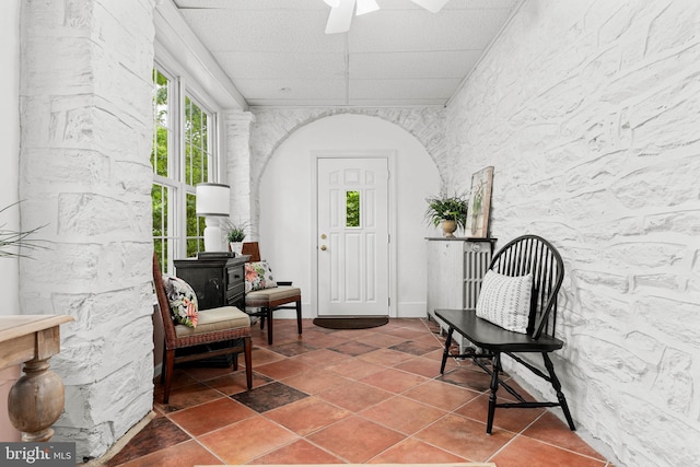 doorway to property featuring a ceiling fan