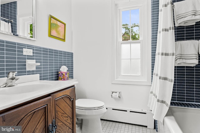 full bathroom with a baseboard heating unit, tile patterned flooring, toilet, tile walls, and vanity