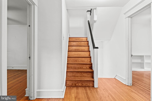 stairs with wood finished floors