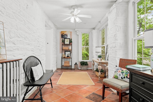sunroom featuring radiator heating unit