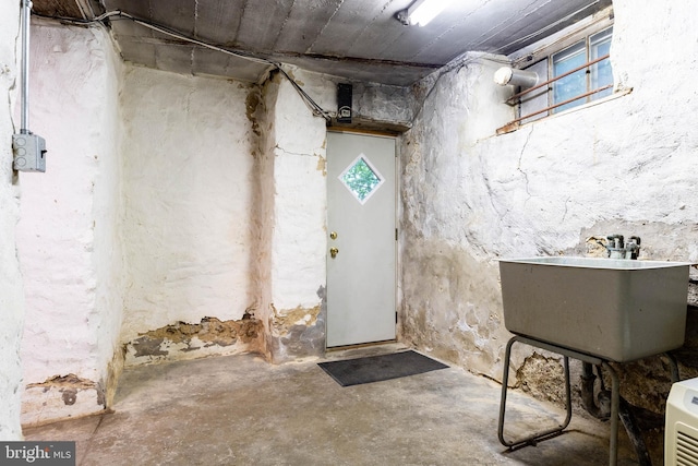 below grade area with a sink