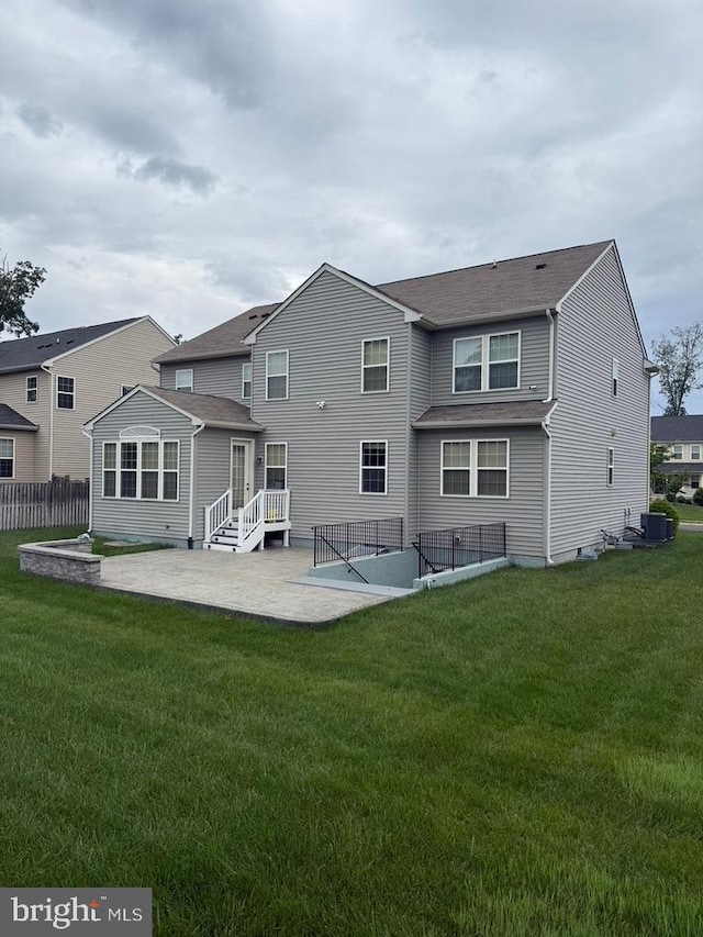14874 Abilene Way, Woodbridge, VA 22193 - back of property featuring a patio area and cooling unit
