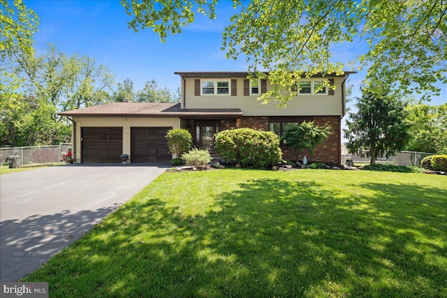 19 Strassberg Ct, Hamilton, NJ 08690 - view of front of property featuring a garage, asphalt driveway, and brick siding