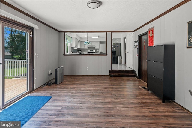 19 Strassberg Ct, Hamilton, NJ 08690 - spare room featuring crown molding, dark wood-style flooring, a textured ceiling, and wood walls