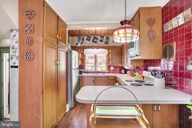 kitchen featuring white appliances, a sink, light countertops, dark wood-type flooring, and open shelves