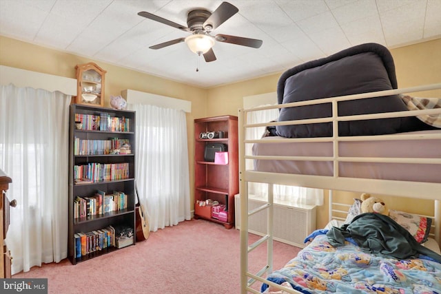 bedroom with carpet floors and a ceiling fan