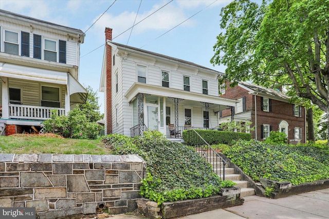 italianate house with covered porch and stairs